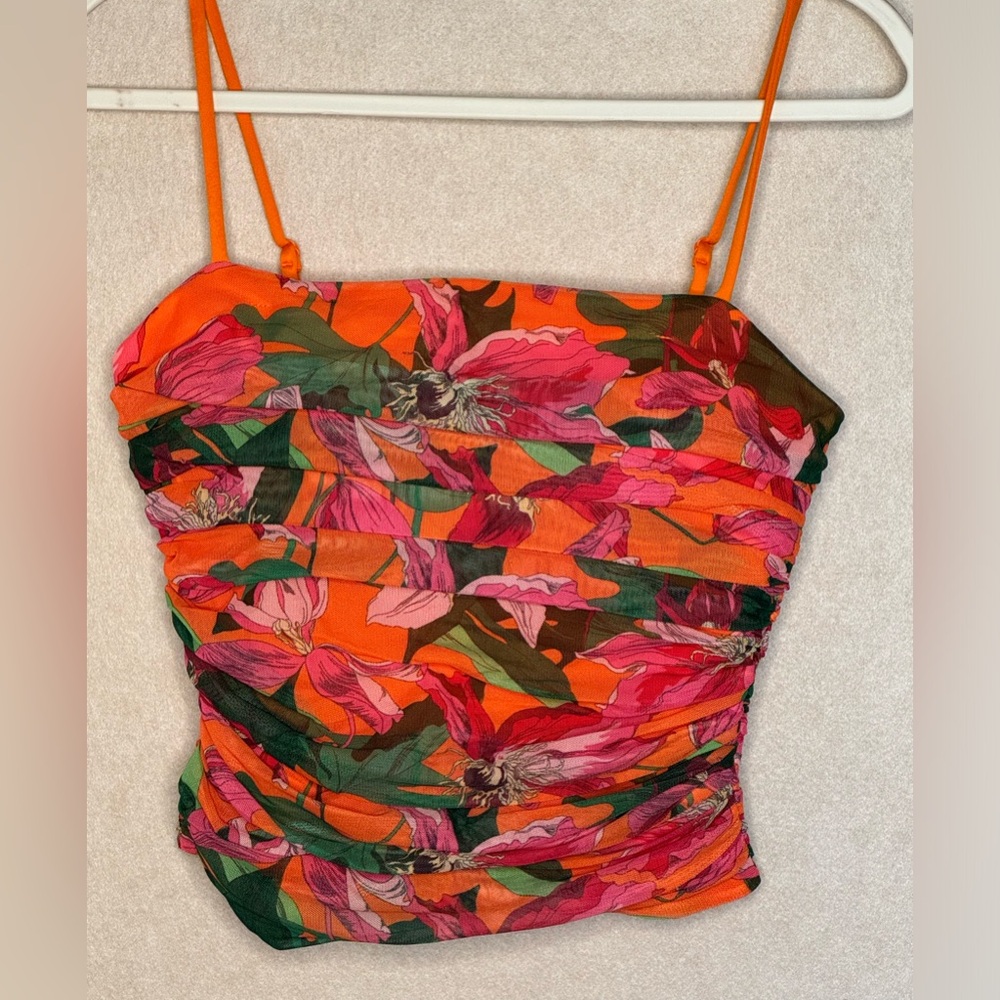 Express printed rouched top NWT. Size medium but runs small. Body contour line.